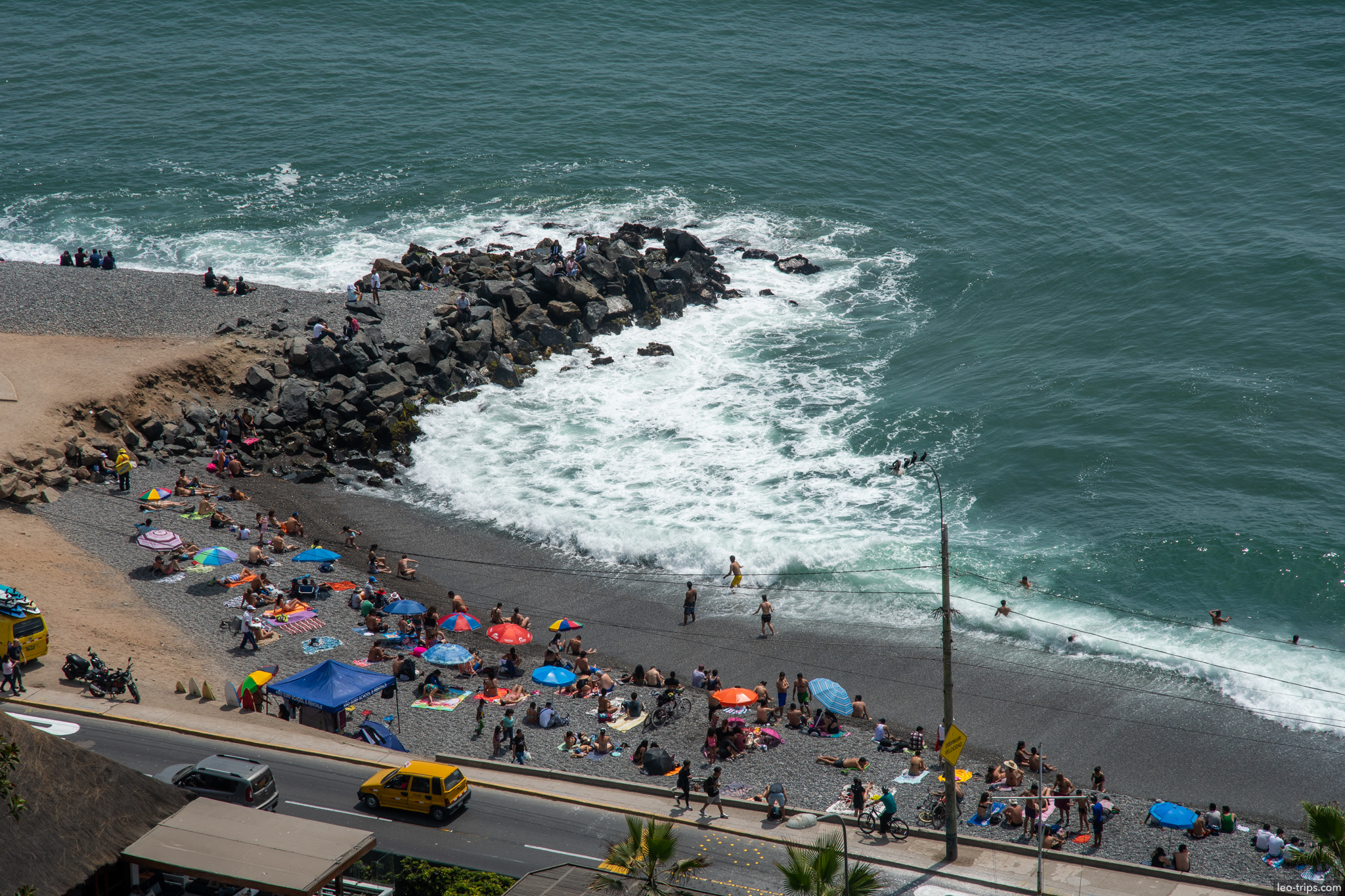 miraflores beach breakwater umbrellas aerial lima