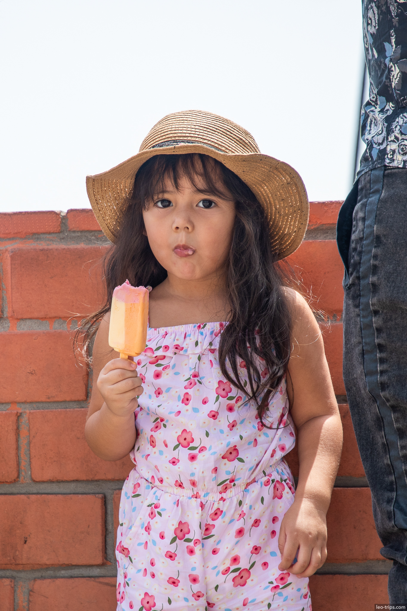 peruvian girl ice cream straw hat beach lima