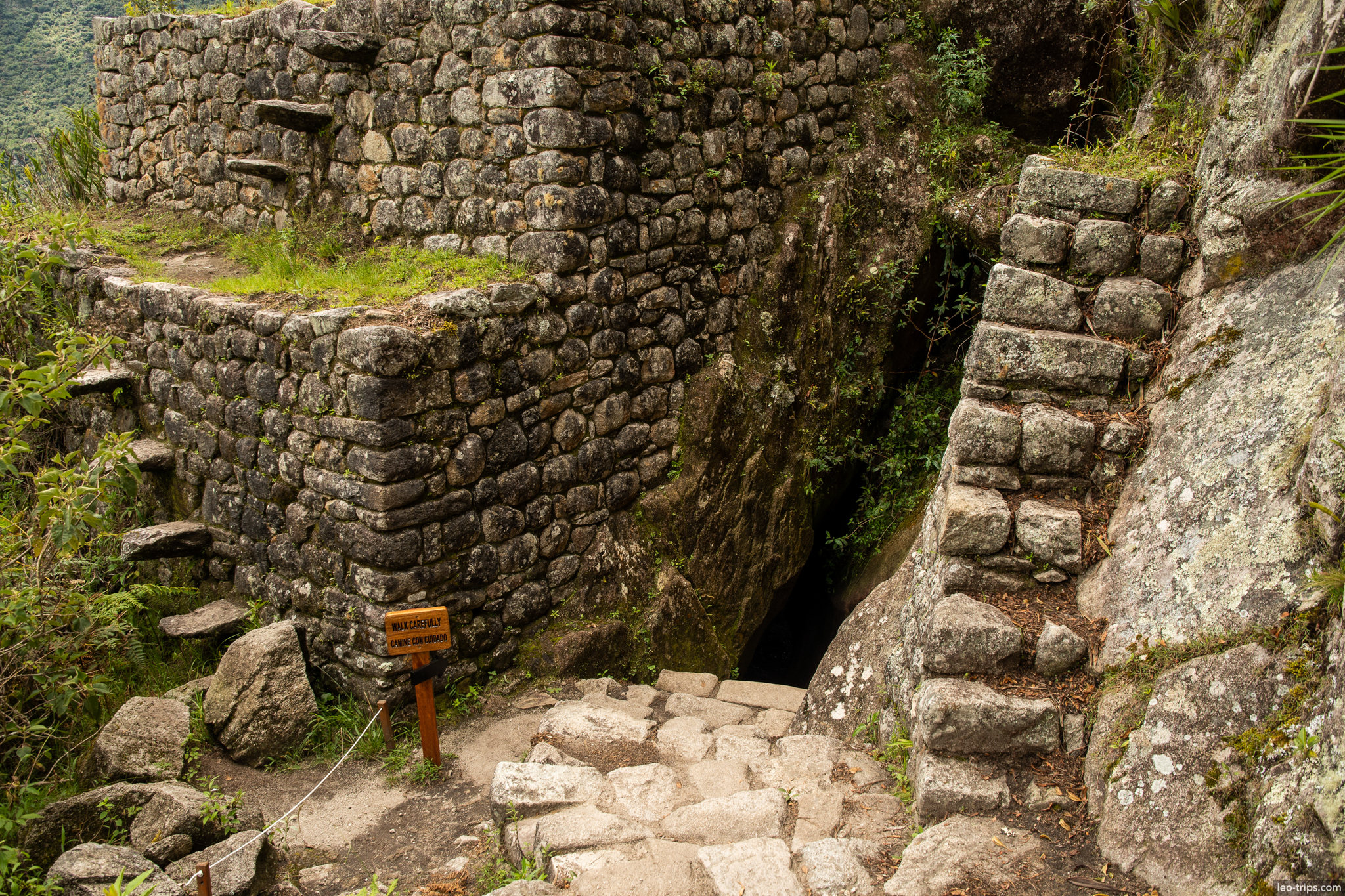 huayna picchu tunnel cave passage warning sign machu picchu