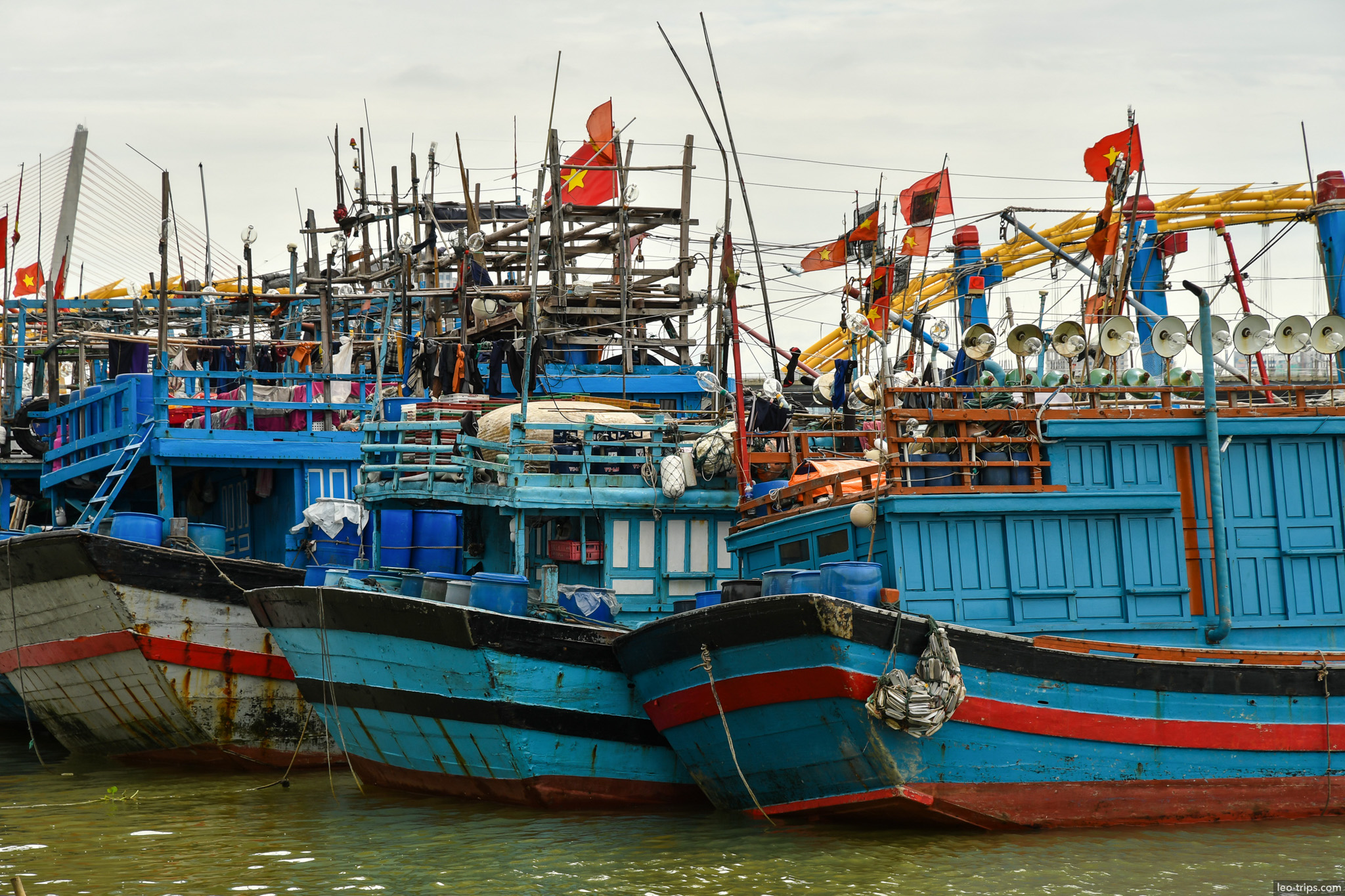 danang fishing harbor blue boats vietnamese flags da nang