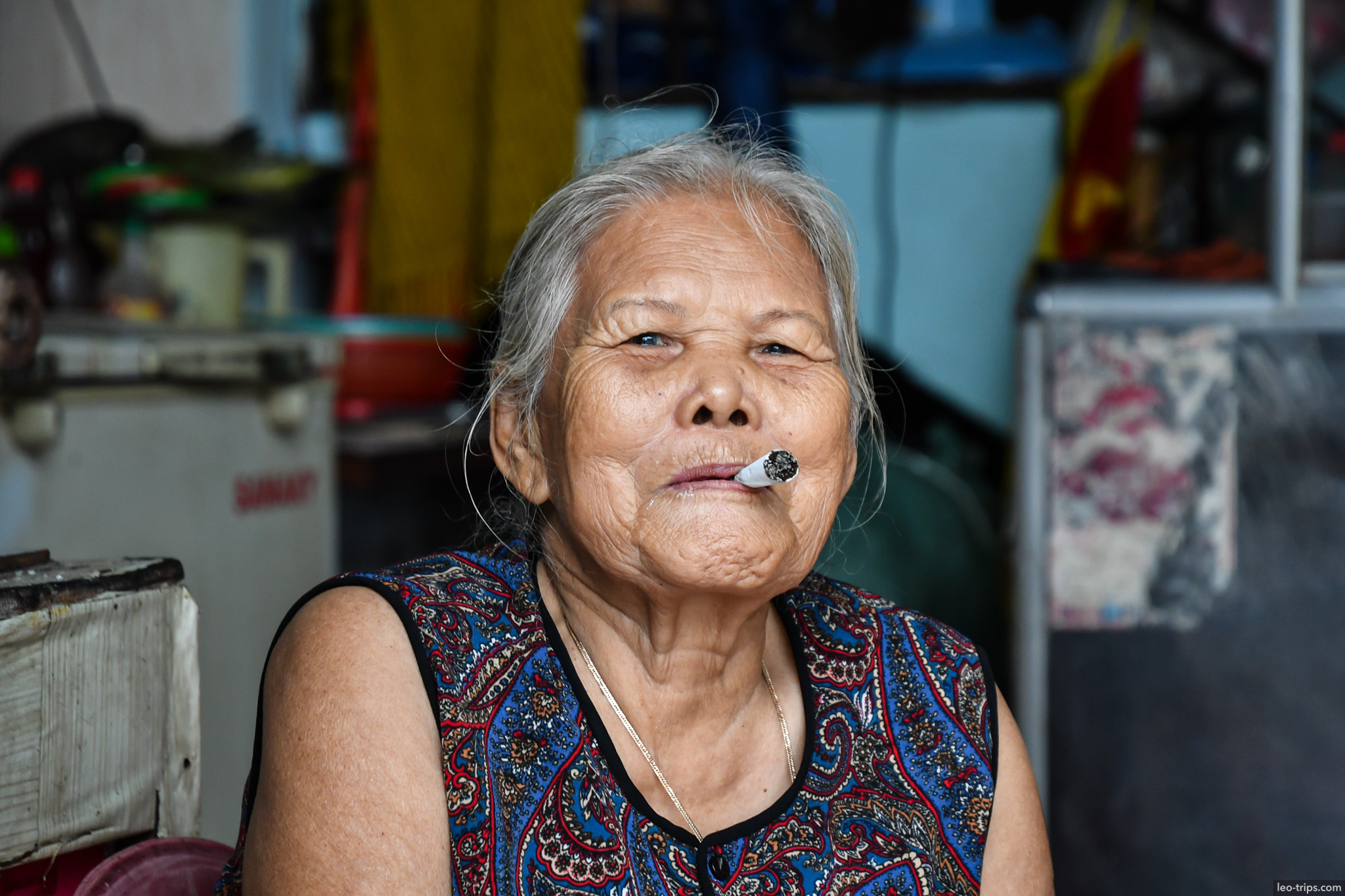 elderly vietnamese woman smoking cigarette portrait da nang