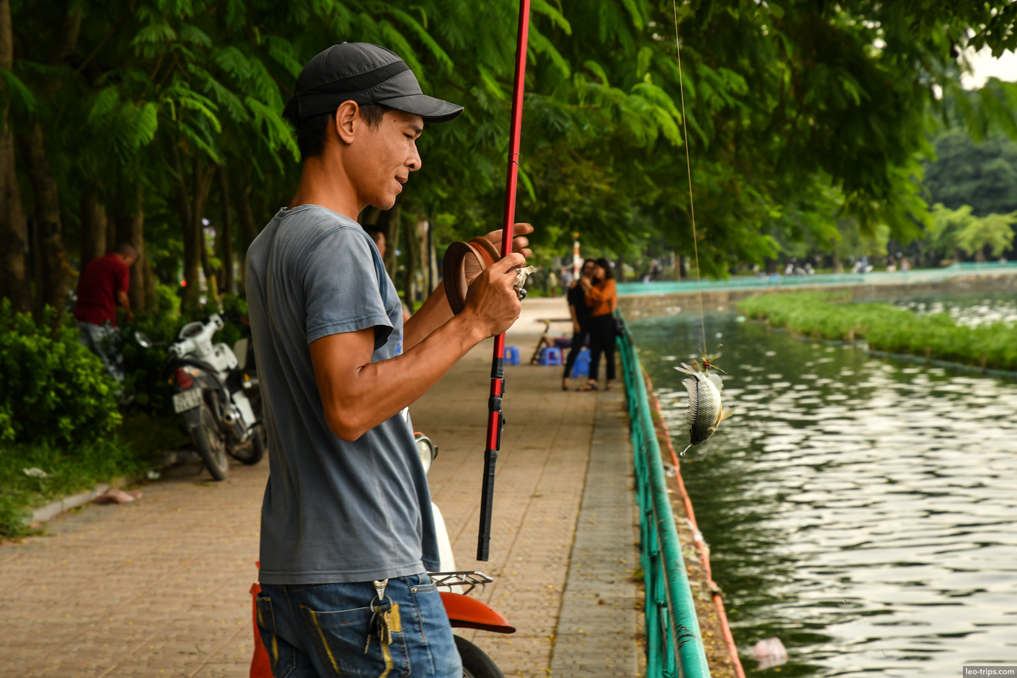 fisherman catching fish west lake hanoi hanoi