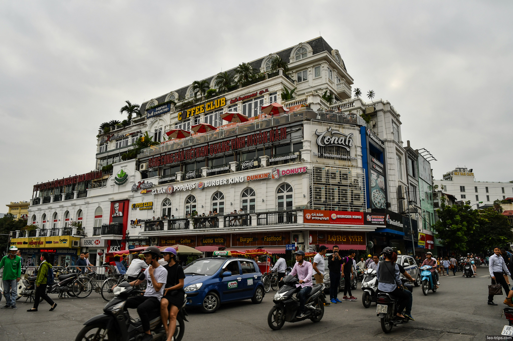 french colonial corner building busy intersection hanoi hanoi