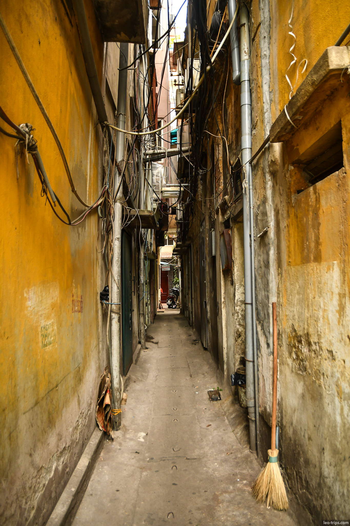narrow alley yellow walls wires hanoi old quarter hanoi