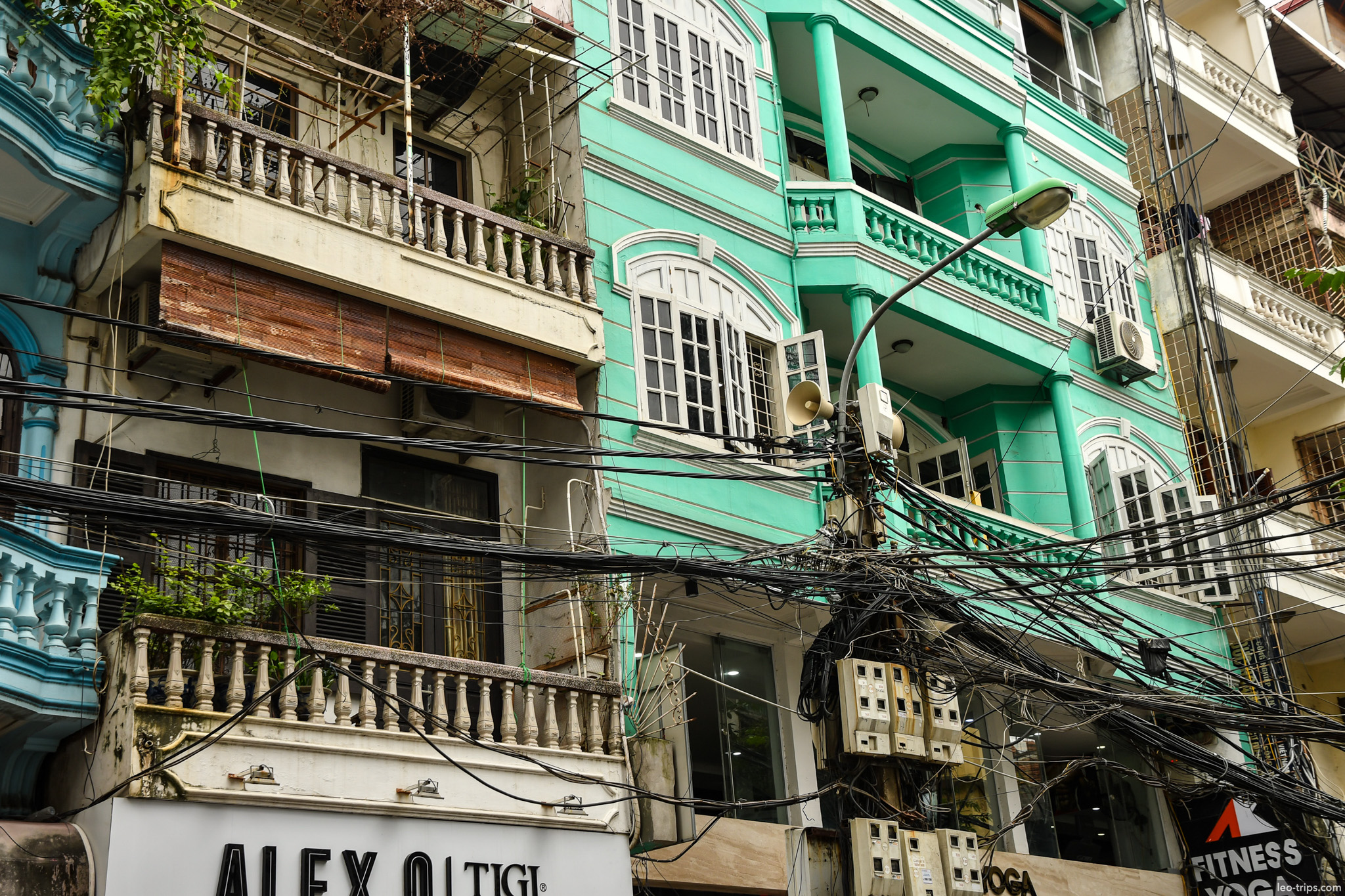 turquoise colonial building tangled wires hanoi hanoi