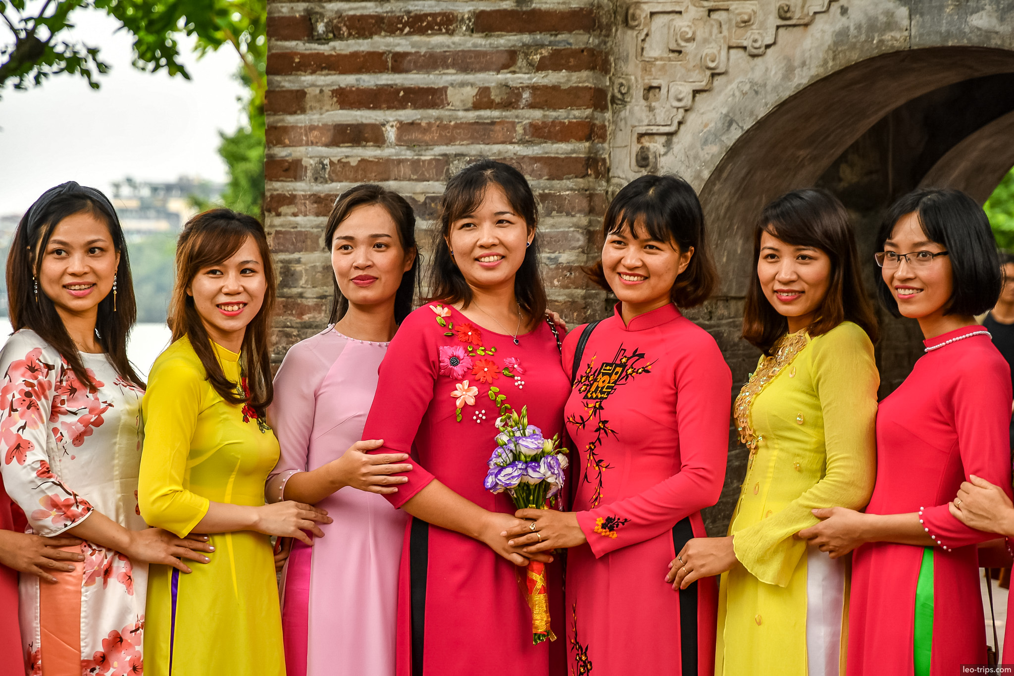 women in ao dai traditional dress ancient gate hanoi hanoi