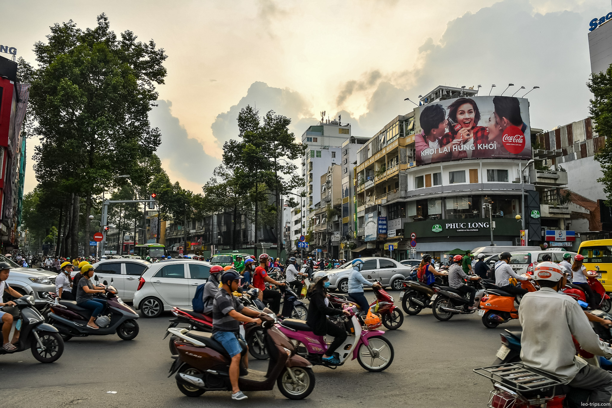 busy intersection phuc long cafe saigon ho chi minh city