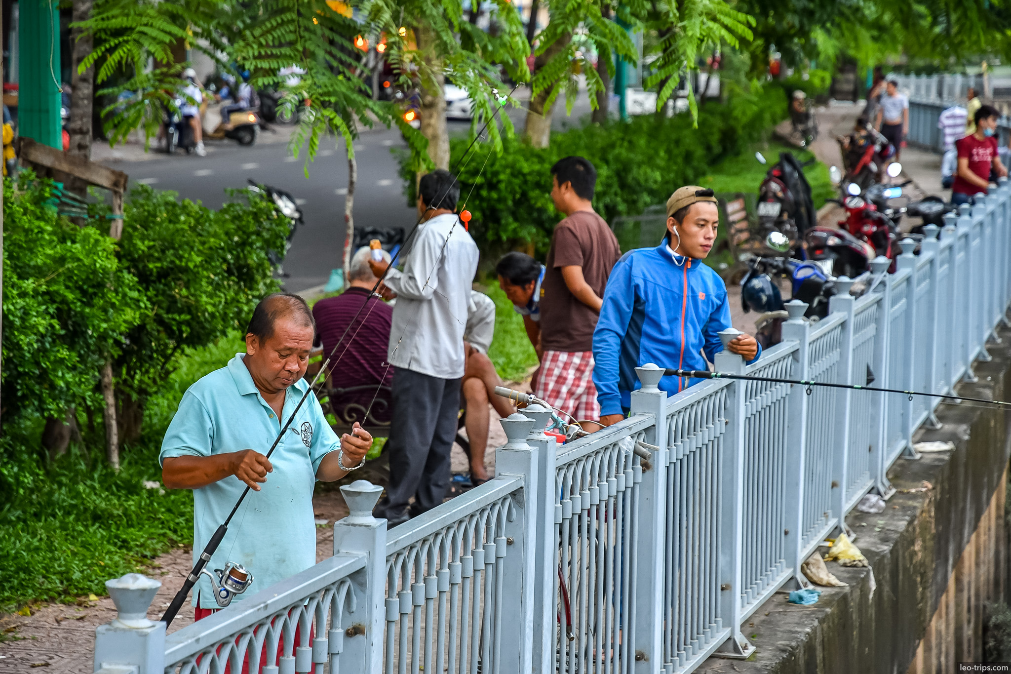 locals fishing canal embankment saigon ho chi minh city