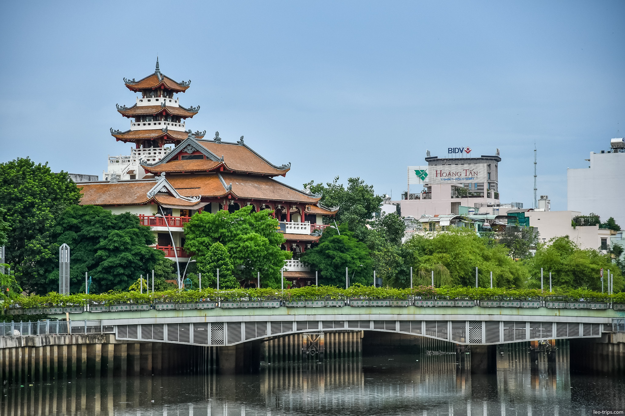 pagoda tower over bridge nhieu loc canal ho chi minh city