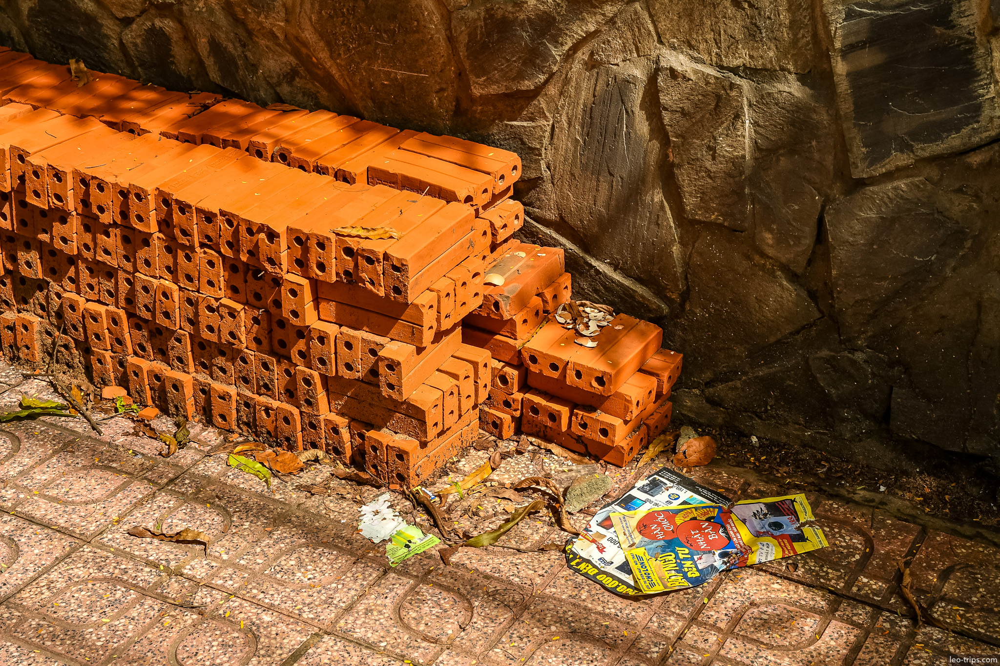 red bricks stacked against stone wall ho chi minh city
