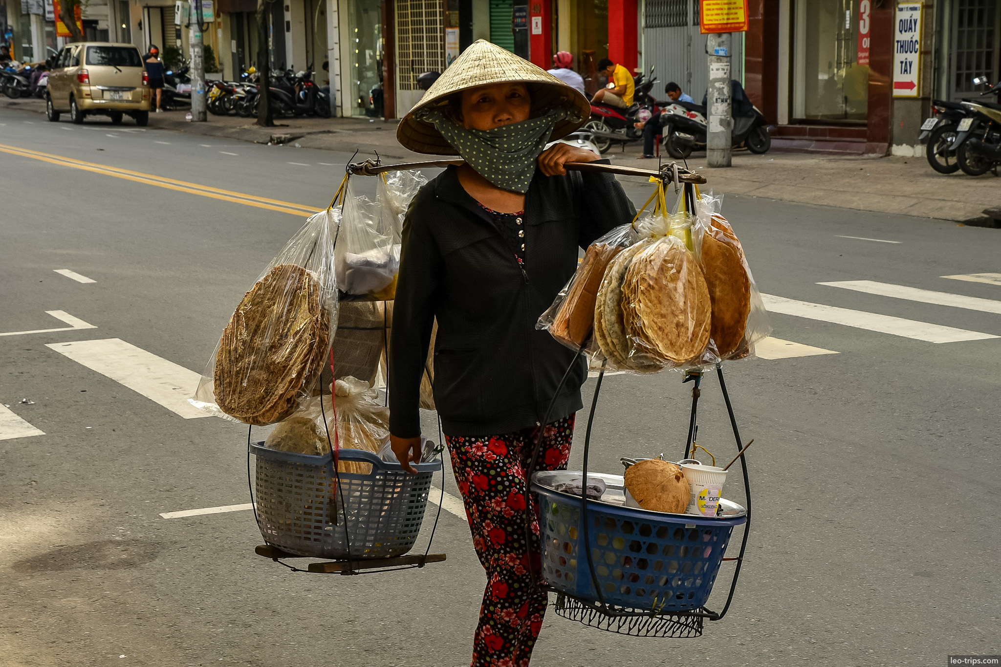 street vendor rice crackers carrying pole ho chi minh city