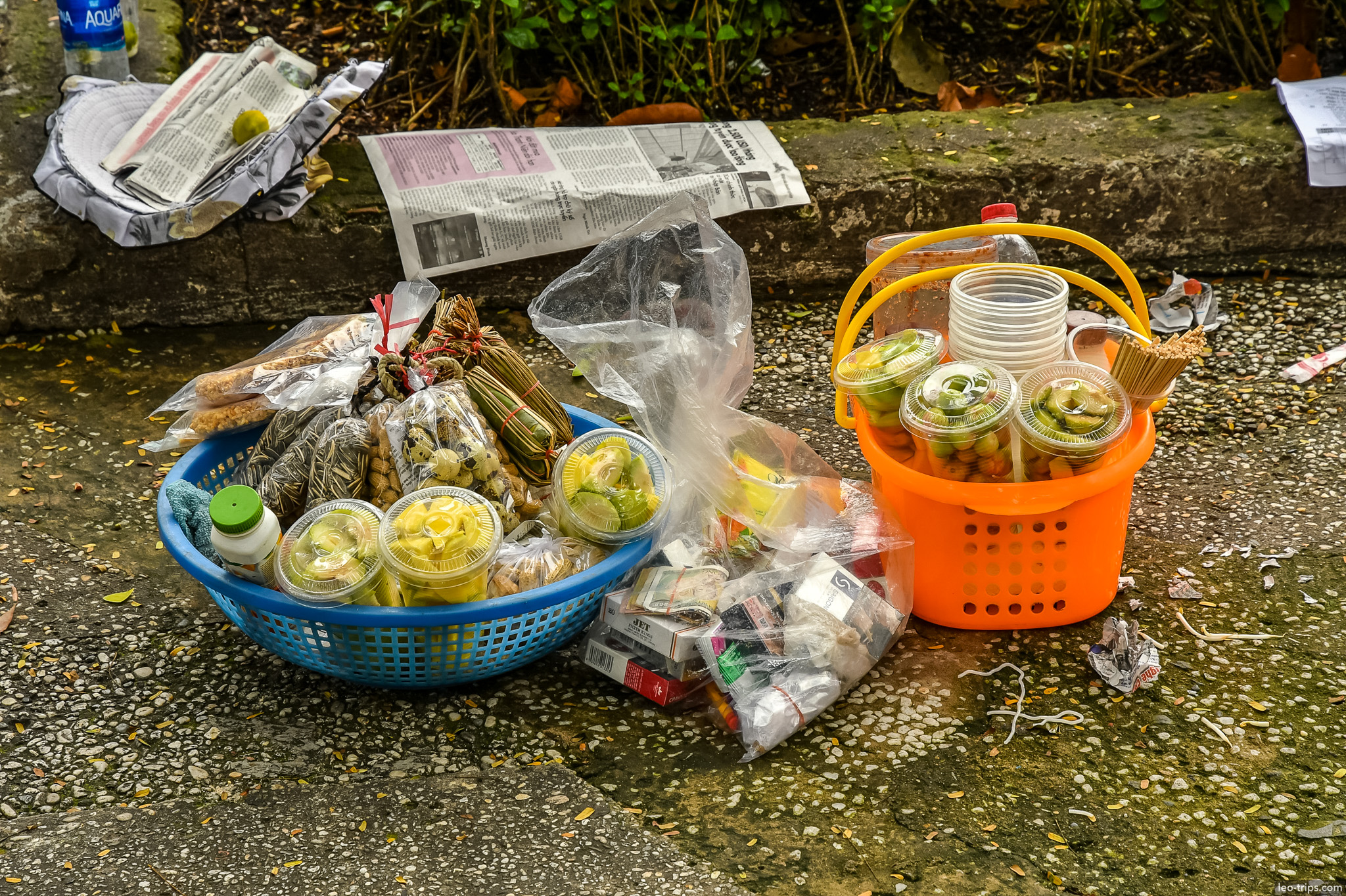 street vendor snacks baskets saigon sidewalk ho chi minh city