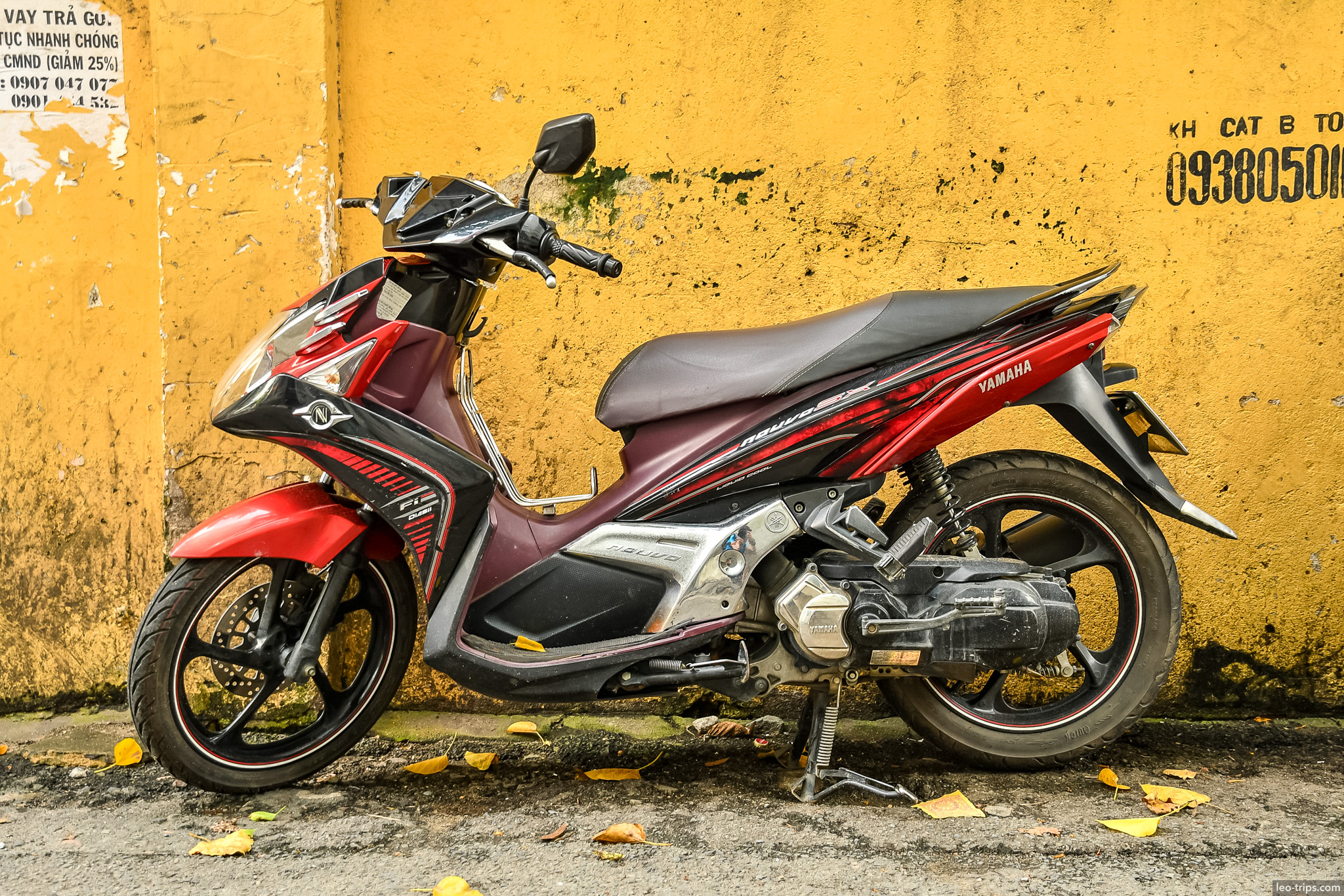 yamaha nouvo scooter yellow wall saigon ho chi minh city