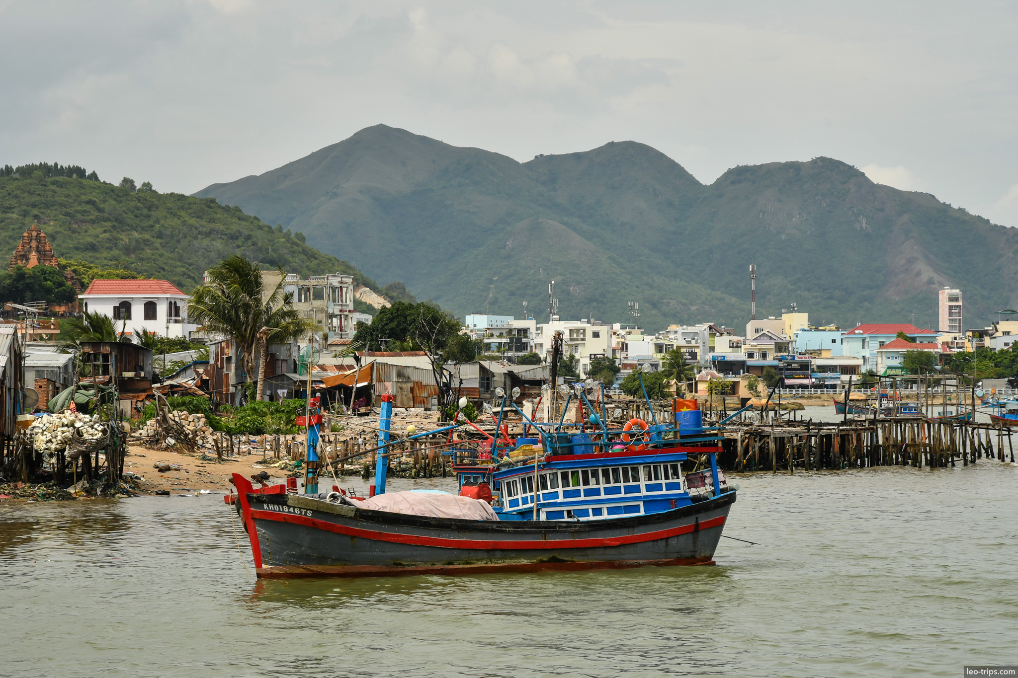 blue fishing boat tran phu bridge background nha trang